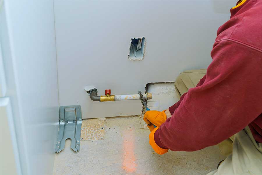 Leak Hounds technician completing a gas line installation inside a Torrance, CA home.