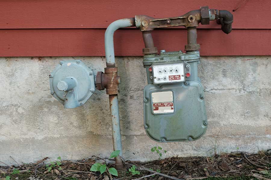 Residential gas meter and piping system installed outside a home in Torrance, CA.
